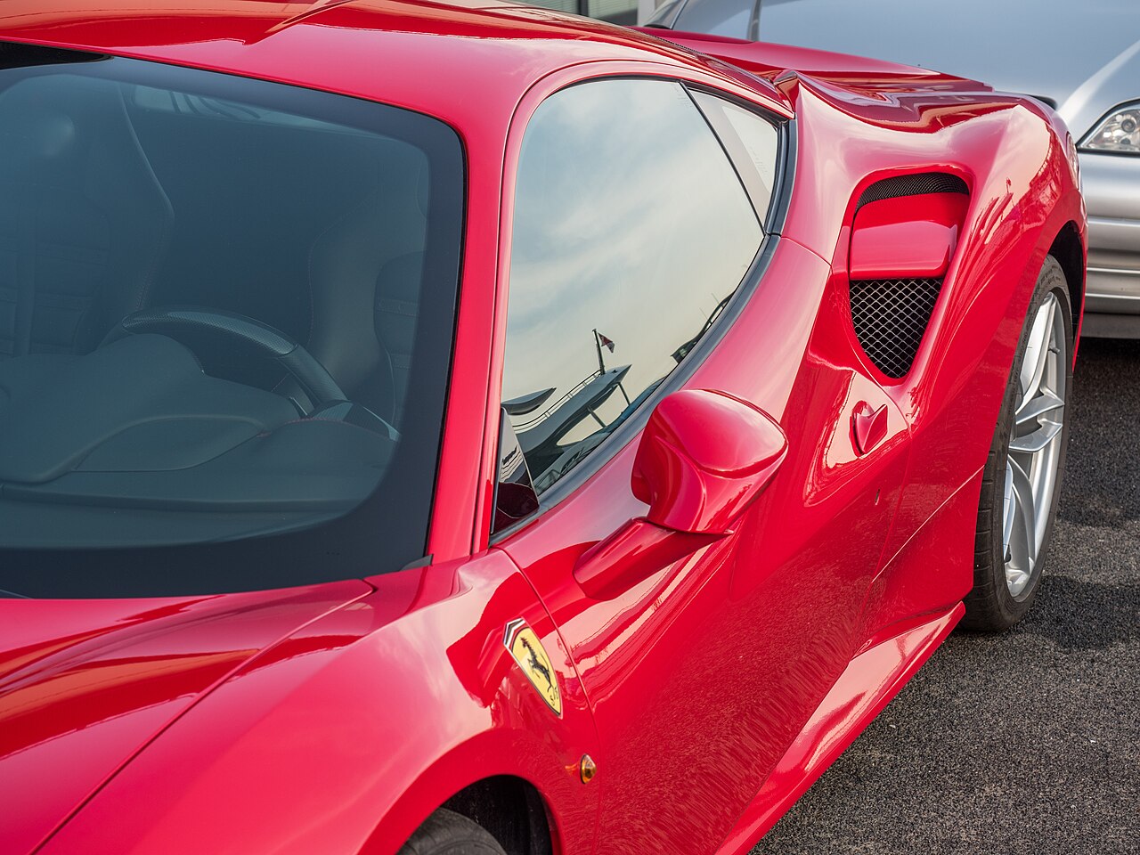 Close-up of the Ferrari 488 GTB side bodywork, window and air intake